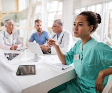 doctors and nurses in their workstations