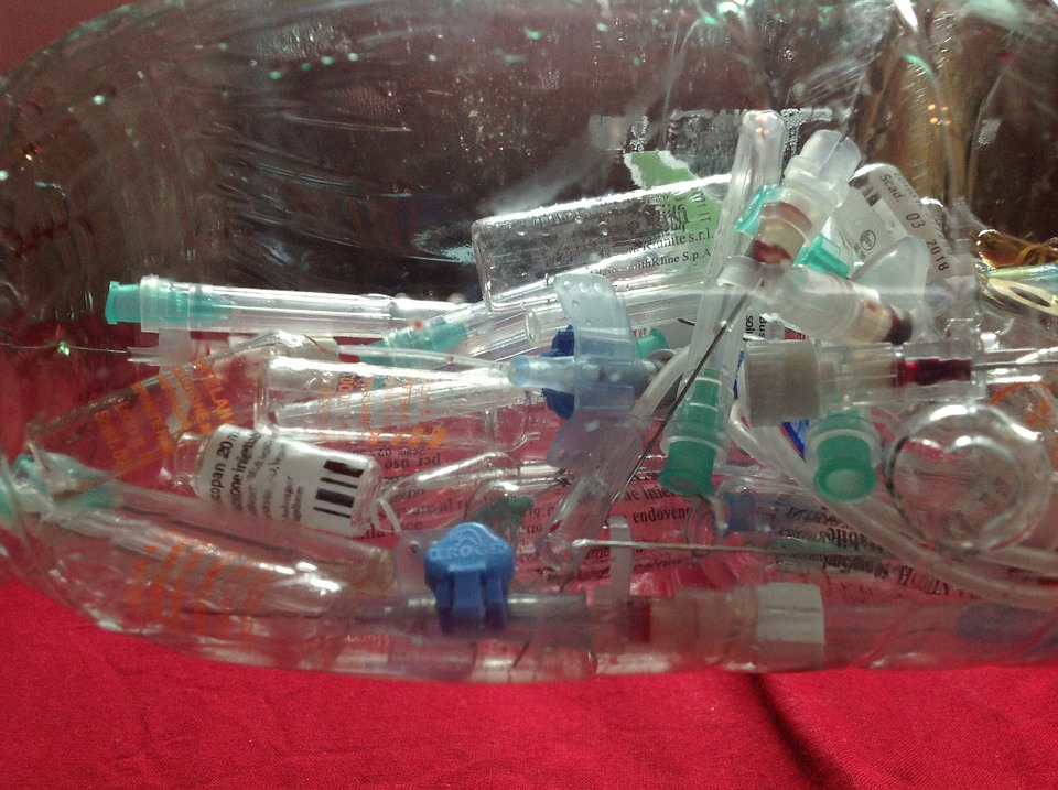 A container full of used syringes.